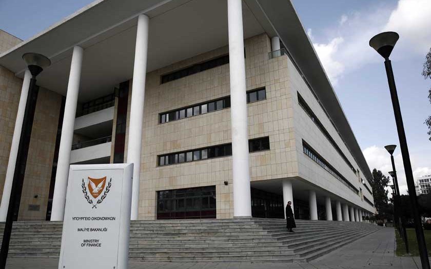 A Woman Leaves Cyprus' Finance Ministry In Nicosia February 21, 2013. Cyprus's Debt Crisis Risks Spreading To Other Euro Zone Countries, The Head Of The Euro Zone's Bailout Fund Said In A Newspaper Interview, Urging A Rapid Decision On Aid For The Mediterranean Island Country. REUTERS/Yorgos Karahalis (CYPRUS - Tags: POLITICS BUSINESS)