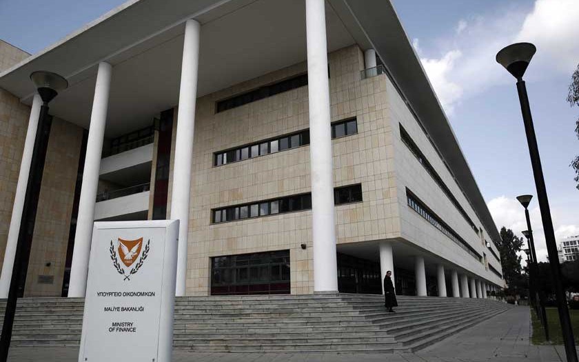 A Woman Leaves Cyprus' Finance Ministry In Nicosia February 21, 2013. Cyprus's Debt Crisis Risks Spreading To Other Euro Zone Countries, The Head Of The Euro Zone's Bailout Fund Said In A Newspaper Interview, Urging A Rapid Decision On Aid For The Mediterranean Island Country.    REUTERS/Yorgos Karahalis (CYPRUS - Tags: POLITICS BUSINESS)